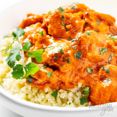 Easy butter chicken recipe in a bowl with fresh cilantro.