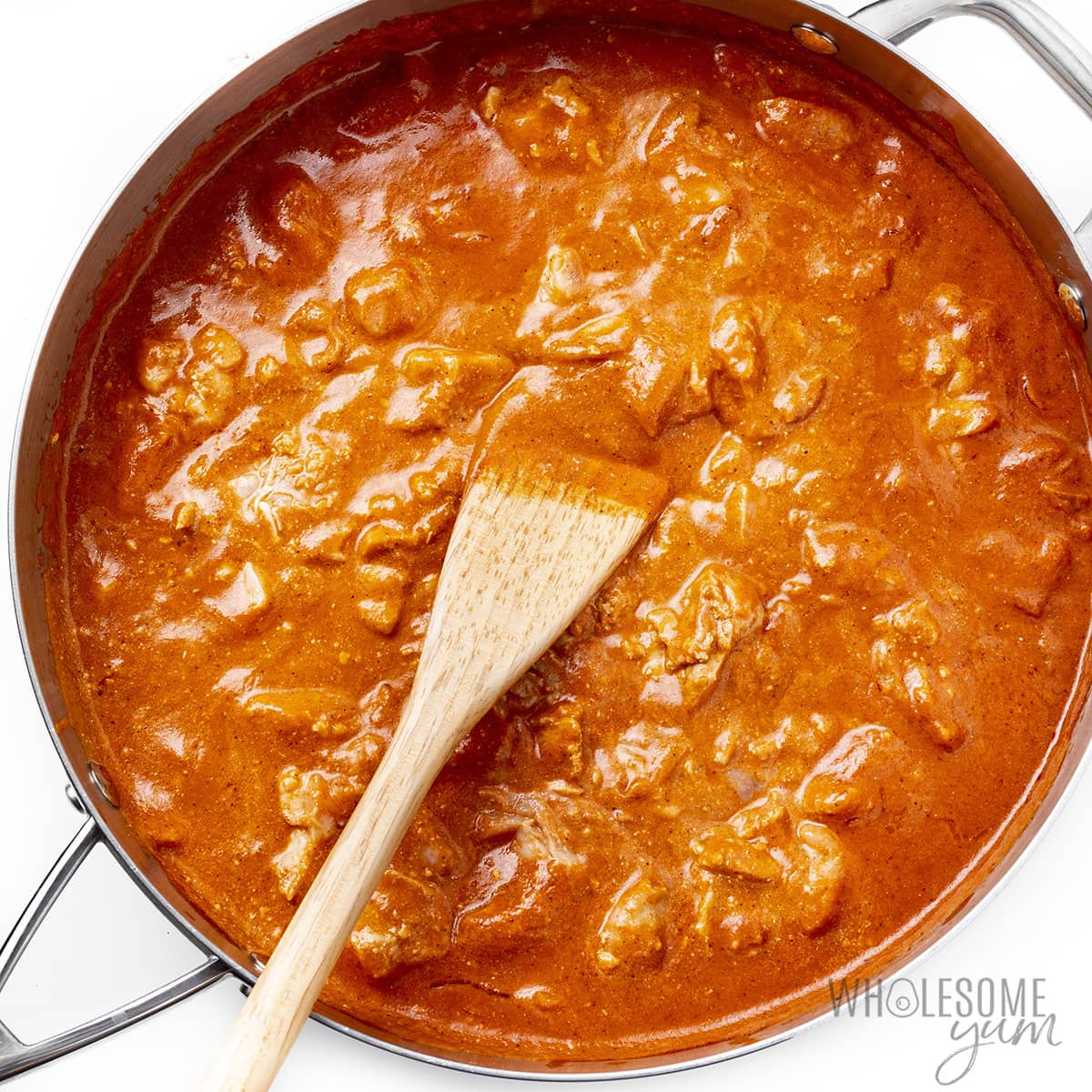 Butter chicken cooked in sauce.