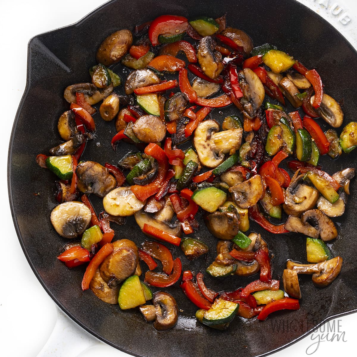 Sauteed veggies in a skillet.