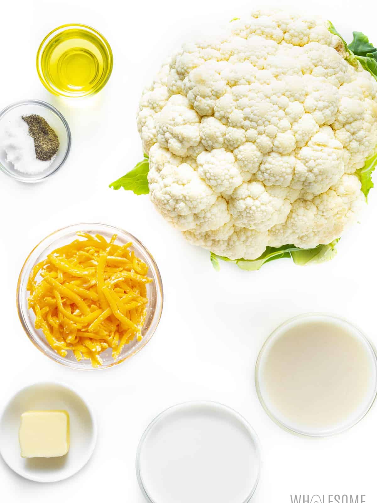Cauliflower and cheese ingredients in bowls.