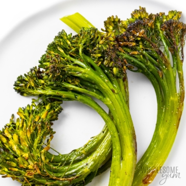 Roasted broccolini recipe on a plate.