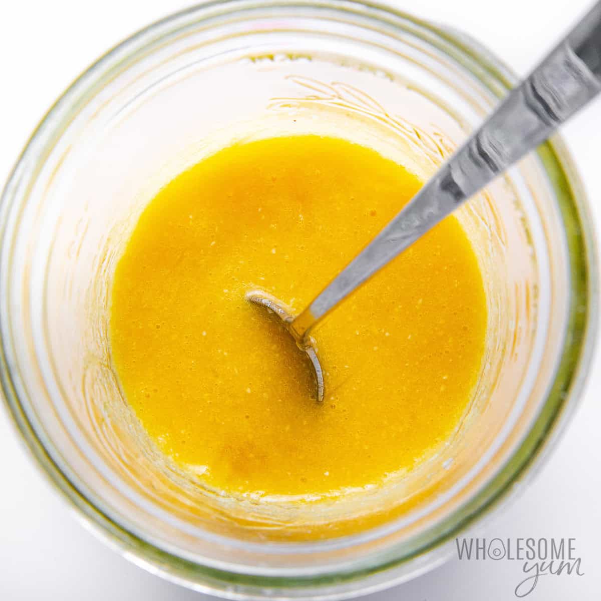 Cake batter ingredients mixed together in a jar.