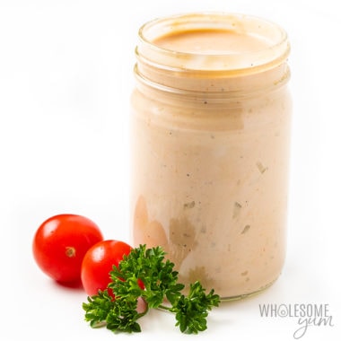jar of keto thousand island dressing with cherry tomatoes