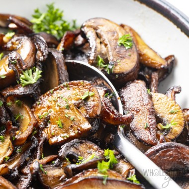 Garlic butter sauteed mushrooms in a bowl.