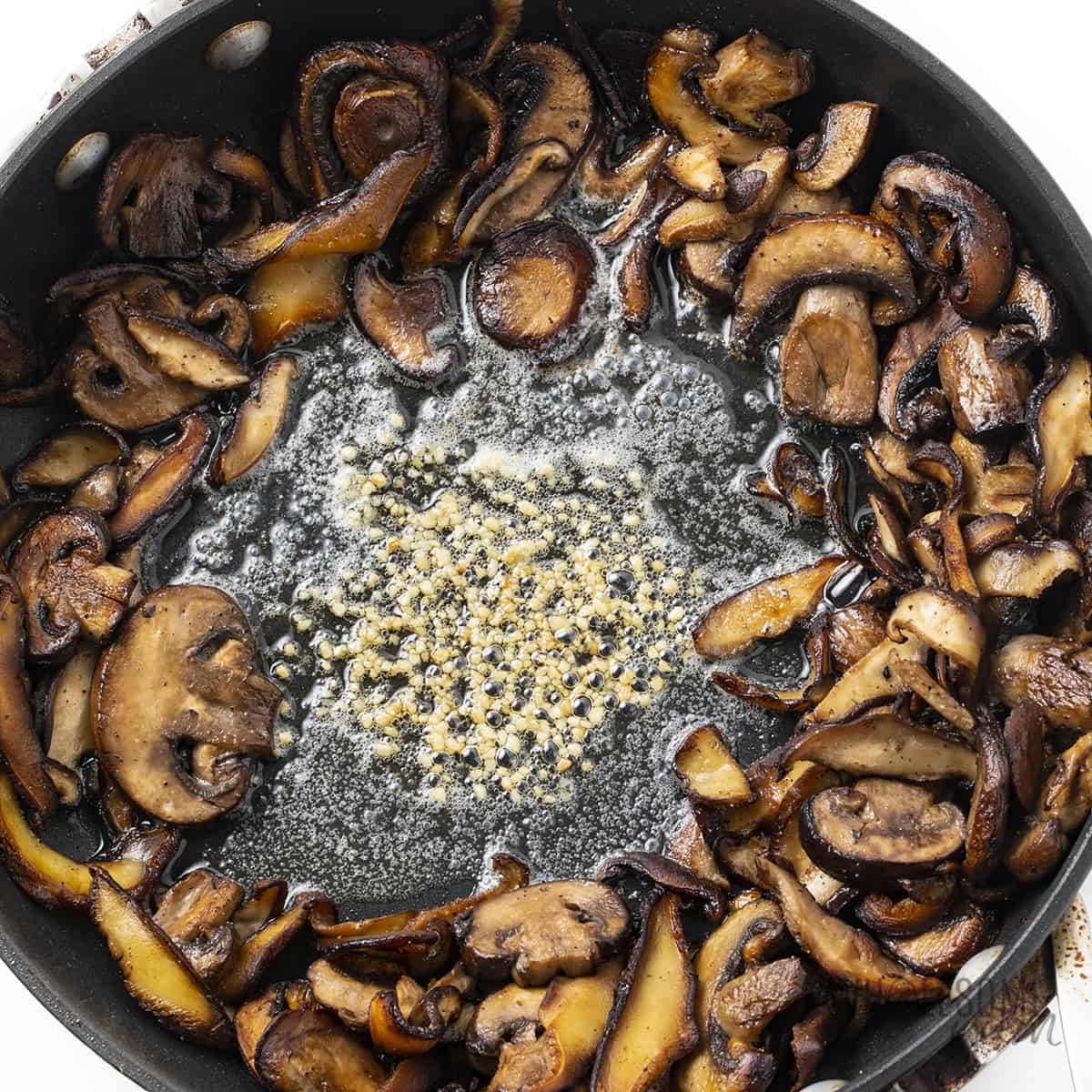 Sauteed mushrooms with garlic added in the center.