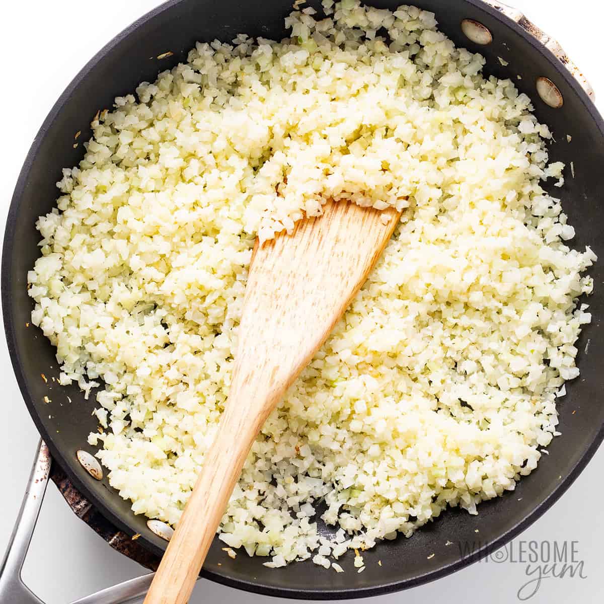 Cauliflower rice in a skillet.