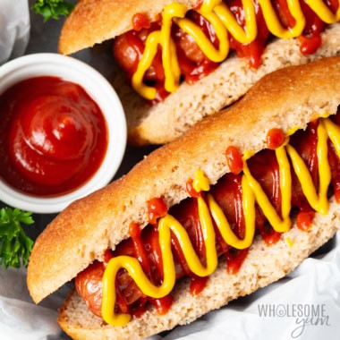Keto hot dog buns with hot dogs and ketchup.