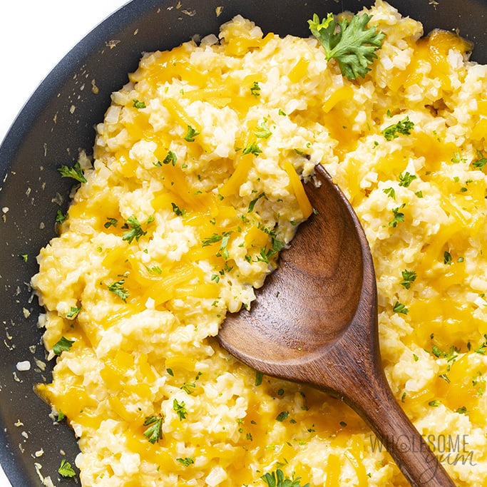 Keto cauliflower rice and cheese with a spinkle of parsley
