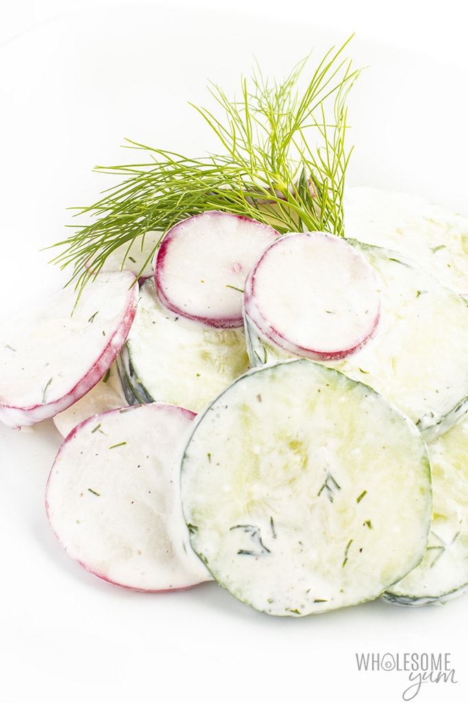 cucumber radish salad on a plate with fresh dill