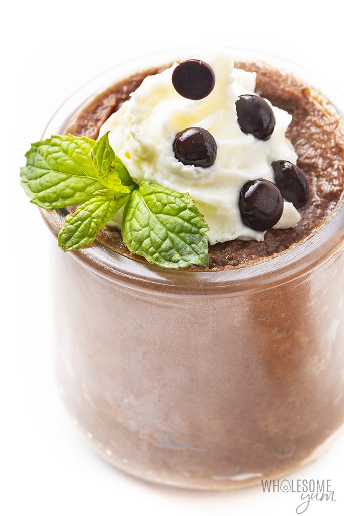Keto friendly chocolate mousse in a glass jar topped with chocolate chips