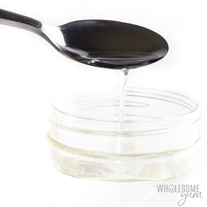 Keto simple syrup pouring off a spoon