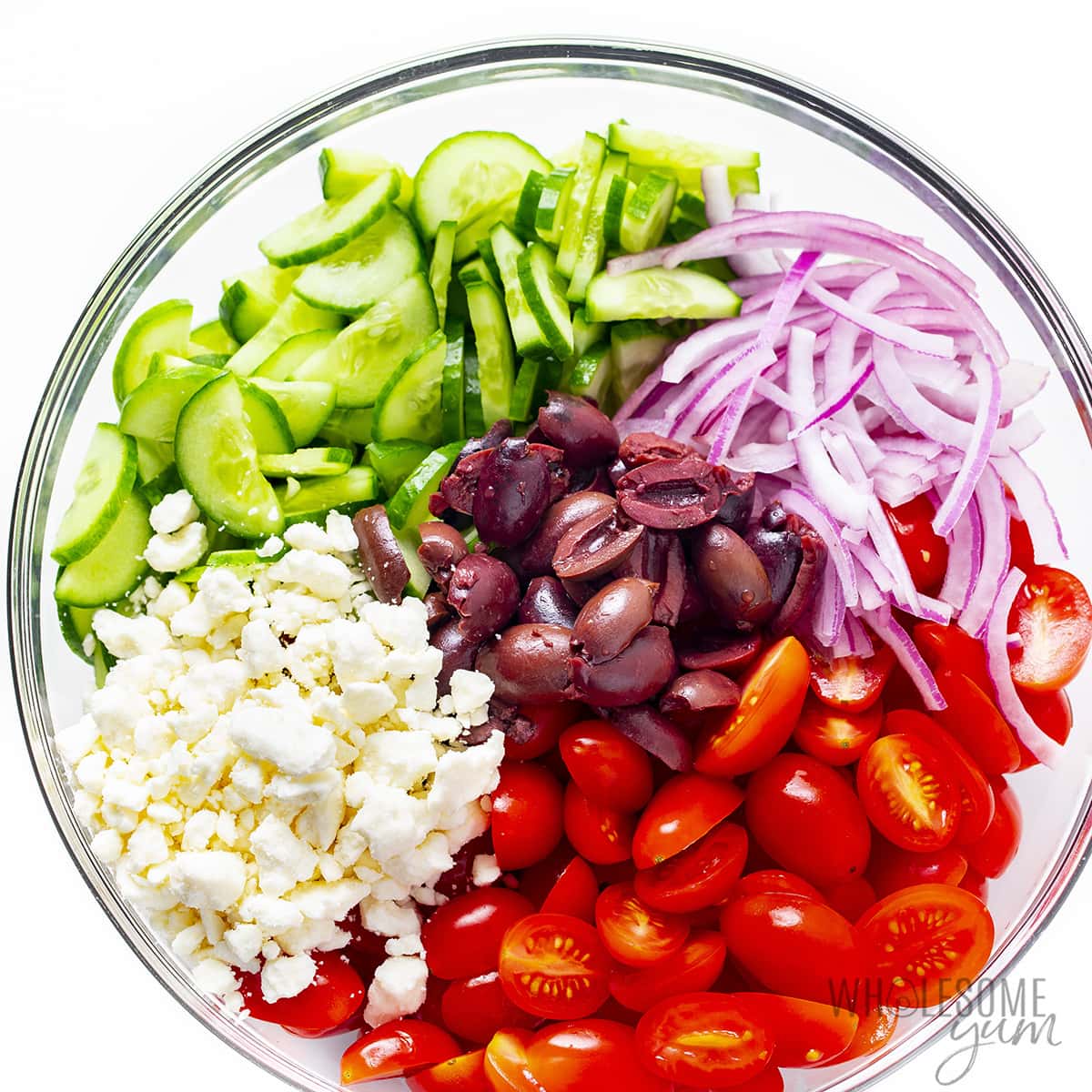 Greek salad ingredients in a large bowl.