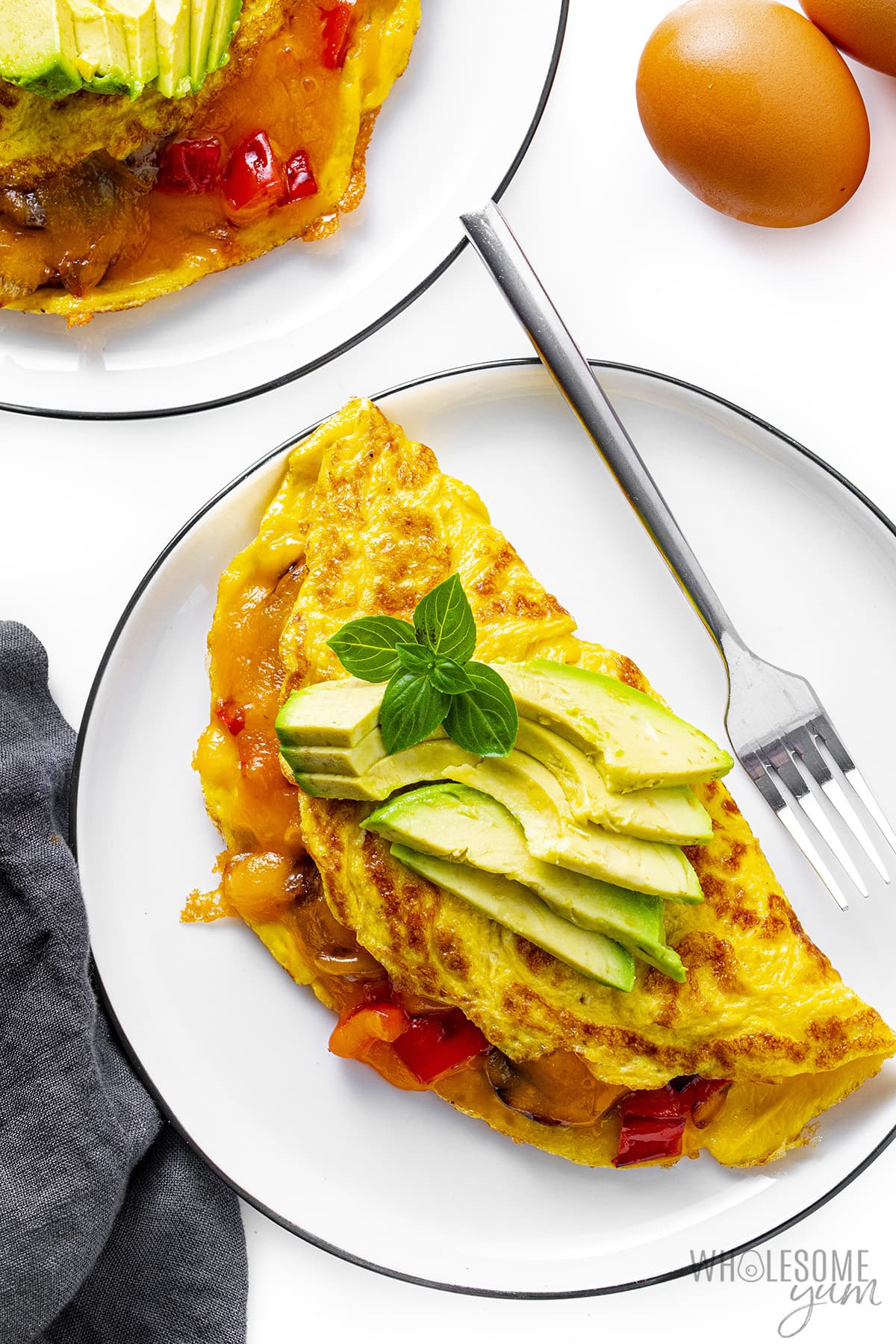Omelette recipe on a plate with a fork.
