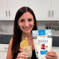 Maya with a refreshing glass of sugar free lemonade and a bag of powdered Besti.