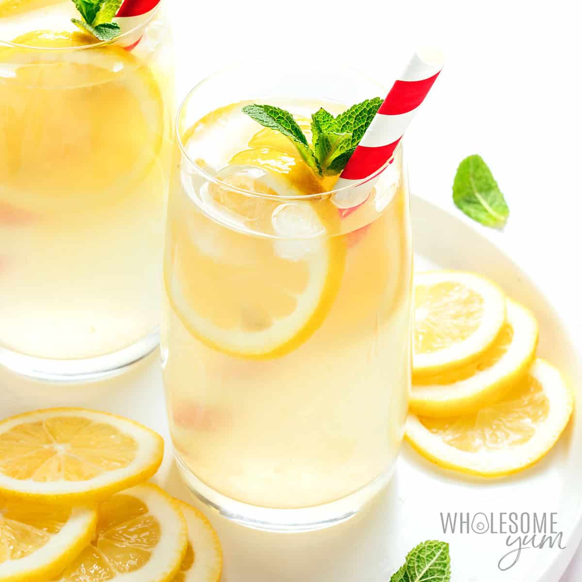 Sugar free lemonade served in a glass with lemon slices.