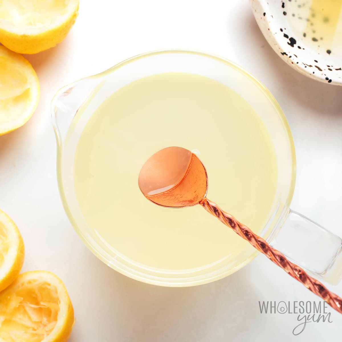 Lemon juice and simple syrup stirred together with a spoon.