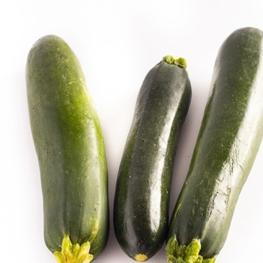 Three zucchinis on a white background.