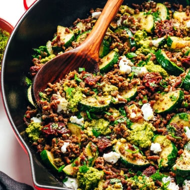 Ground beef zucchini skillet with a wooden spoon.