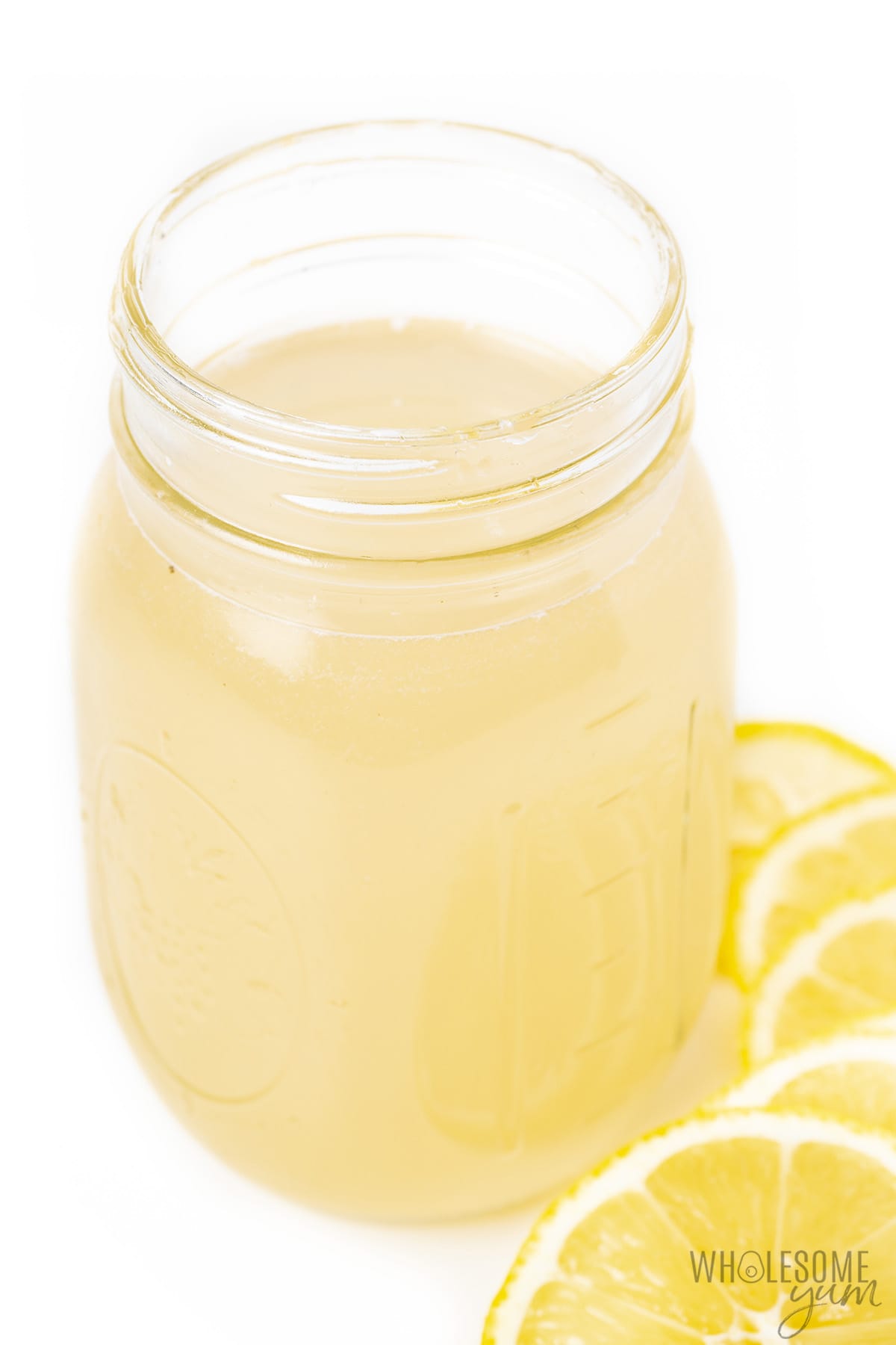 Drink ingredients mixed together in a mason jar.