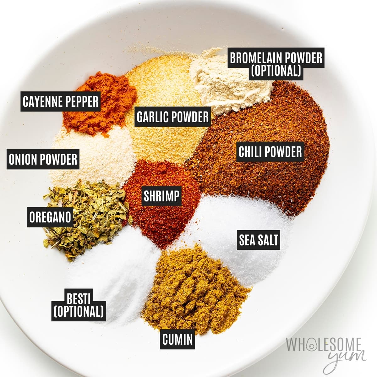 Spices separated out in a bowl with labels.
