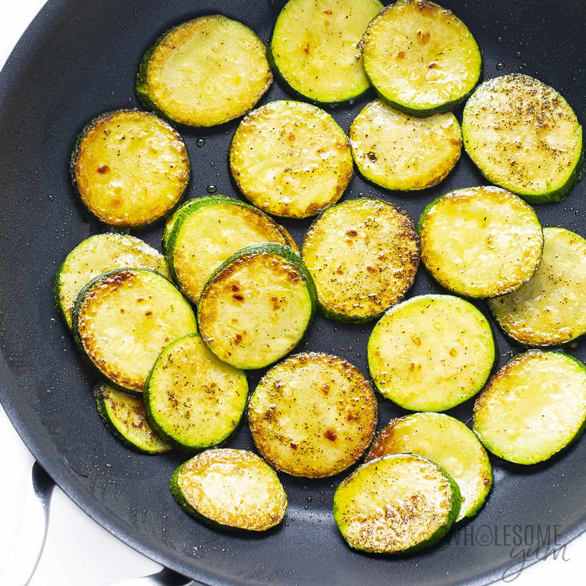 Cooking zucchini in a pan.