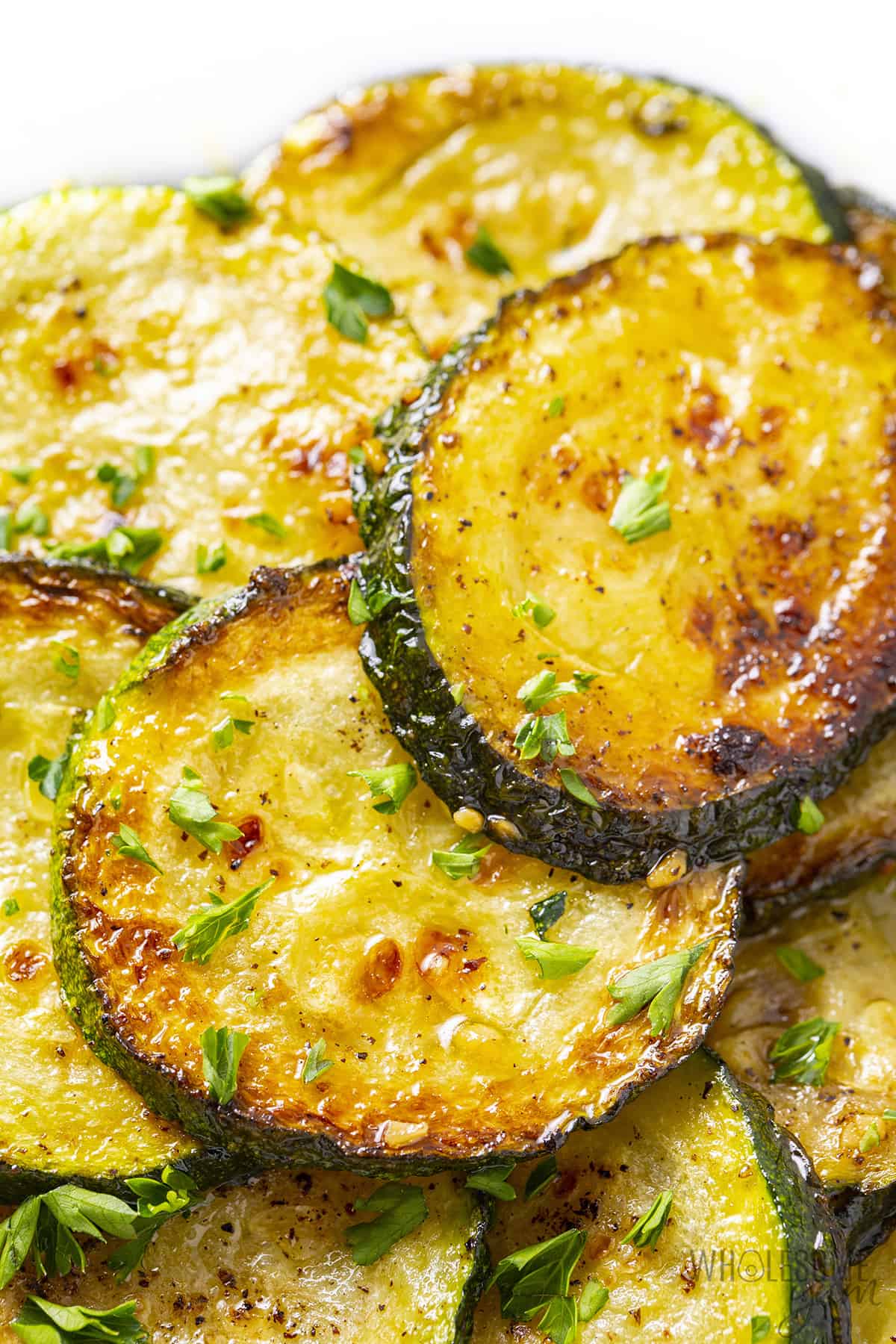 Pan cooked zucchini close up.