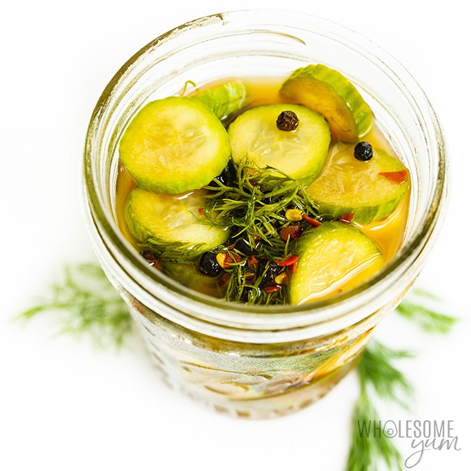 overhead view of a jar of keto pickles with pickles seasonings