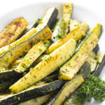 oven roasted zucchini in a white dish