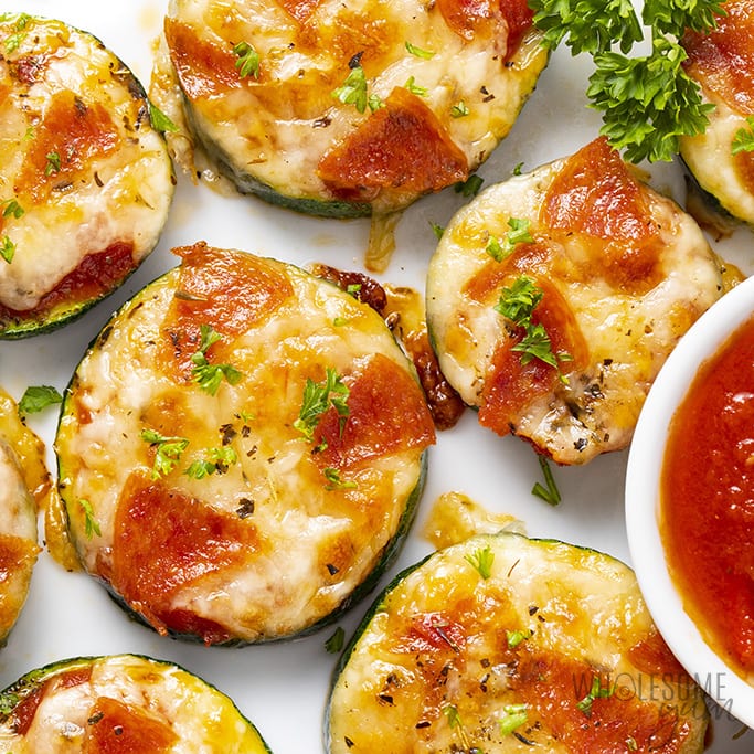 zucchini pizza bites with pepperoni on a plate