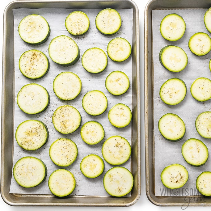 sliced zucchini on baking sheets