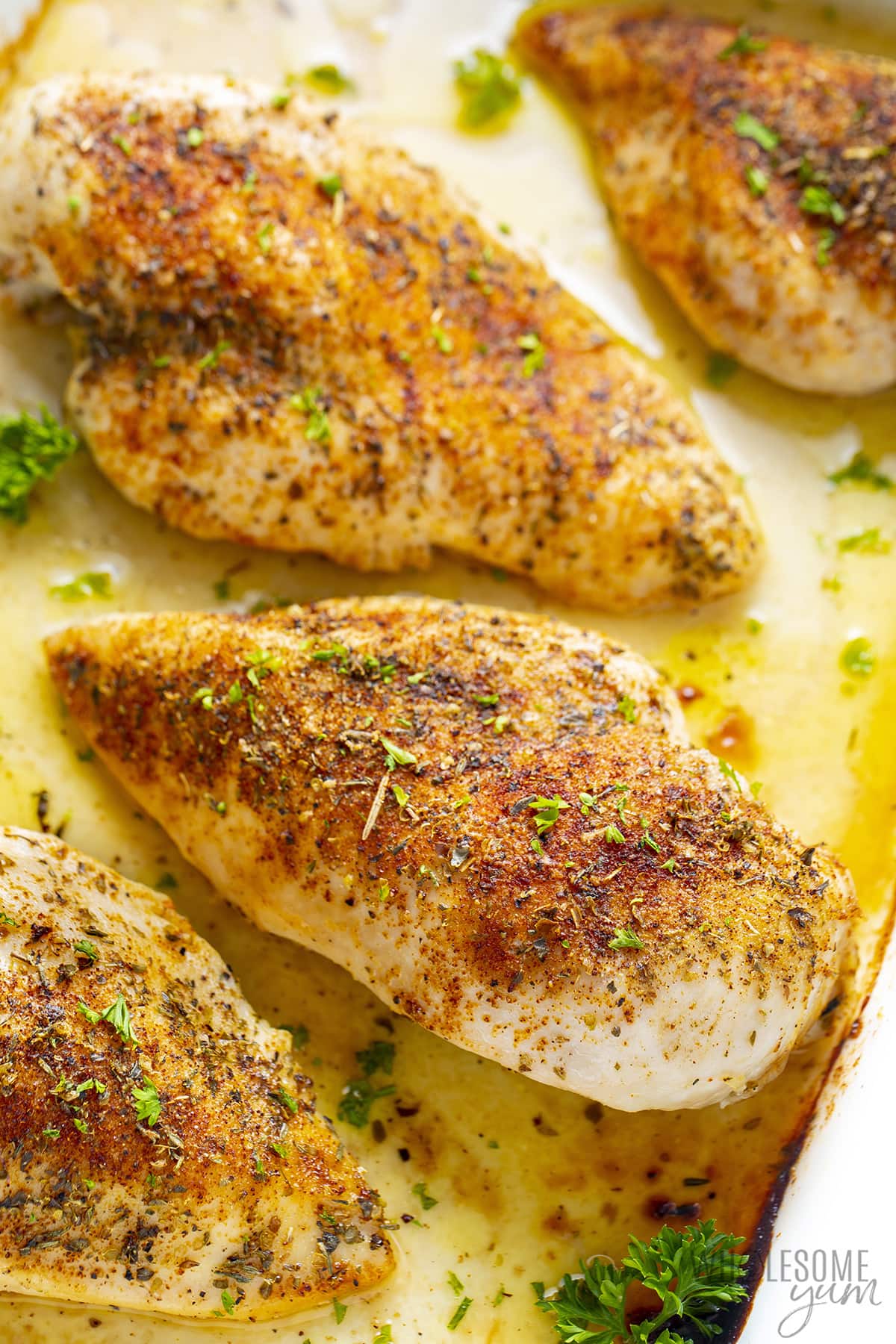 Baked chicken breasts resting.