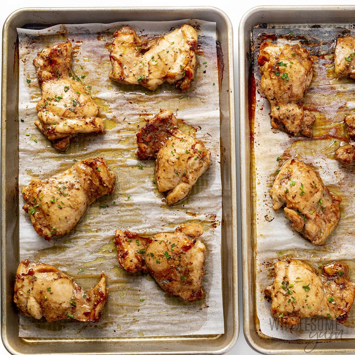 Baked balsamic chicken on baking sheets.