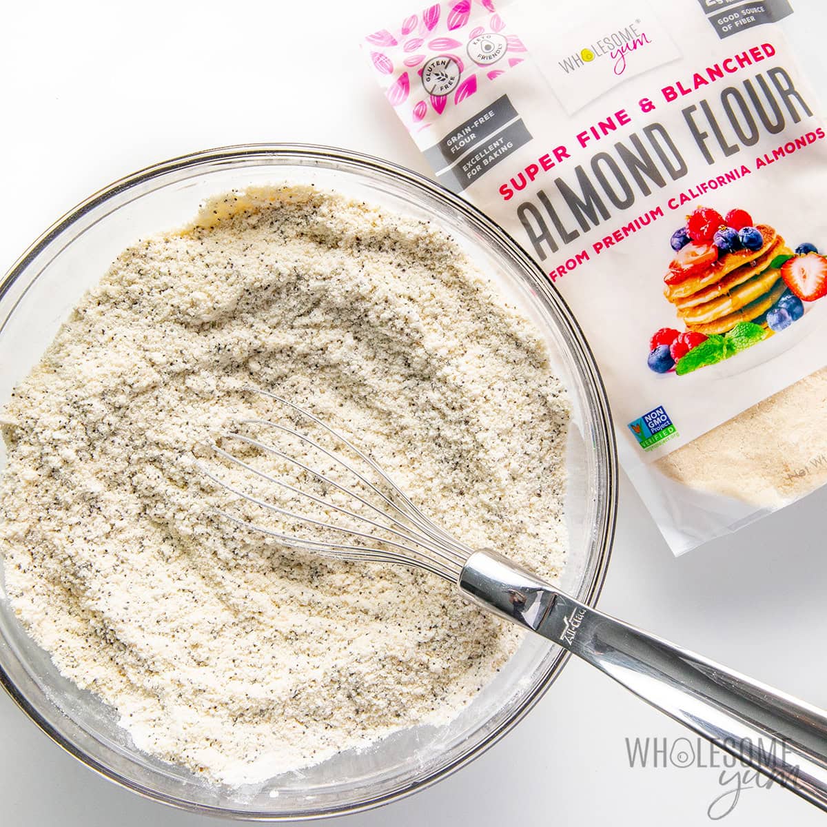 Whisking dry ingredients together in a bowl.