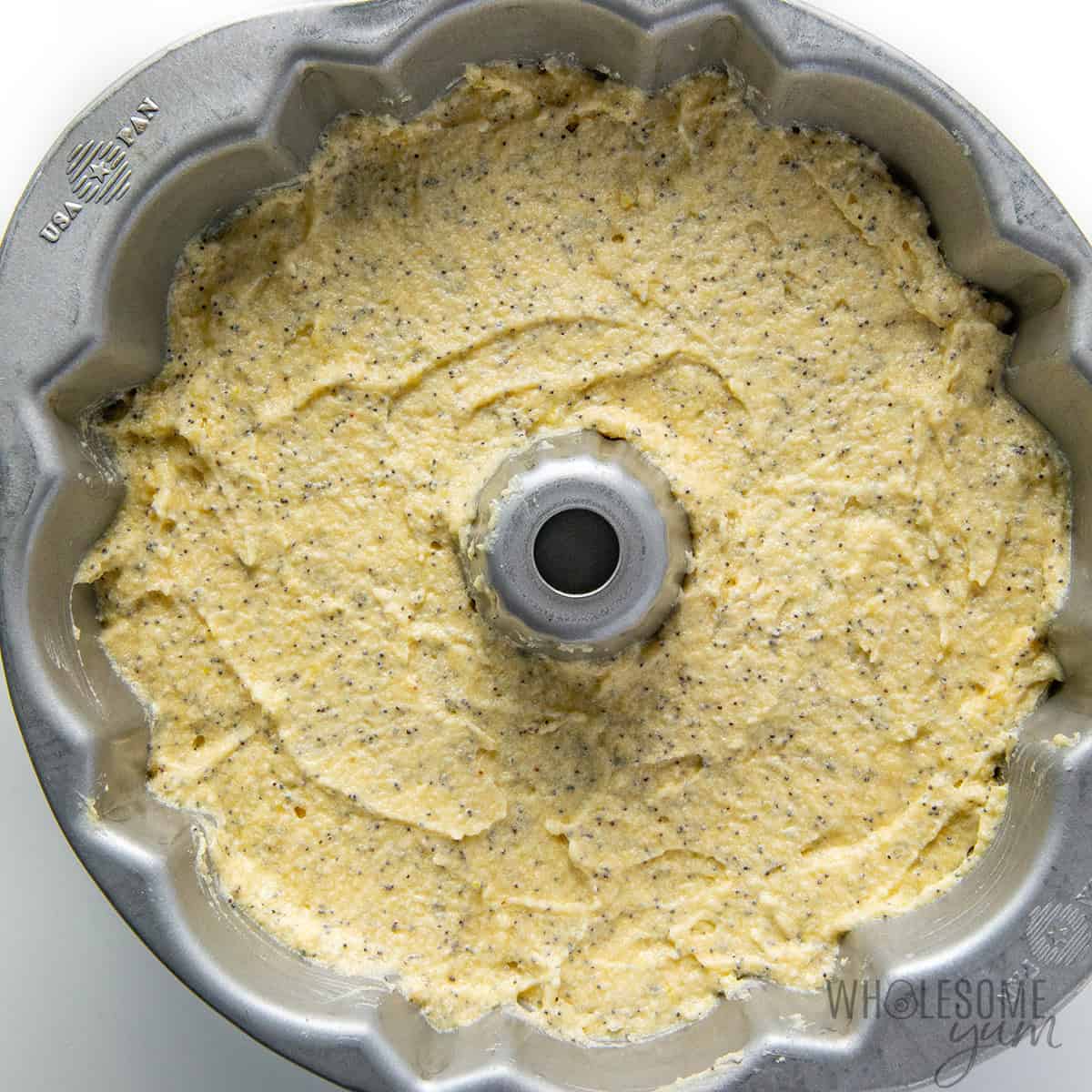 Lemon bundt cake batter poured into a pan.