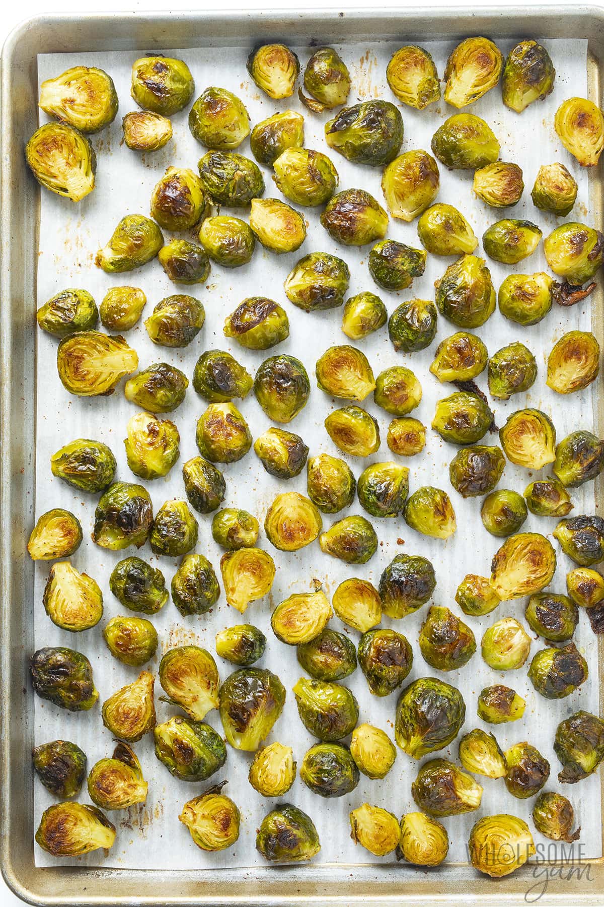 Roast Brussels sprouts in the oven on a baking sheet.