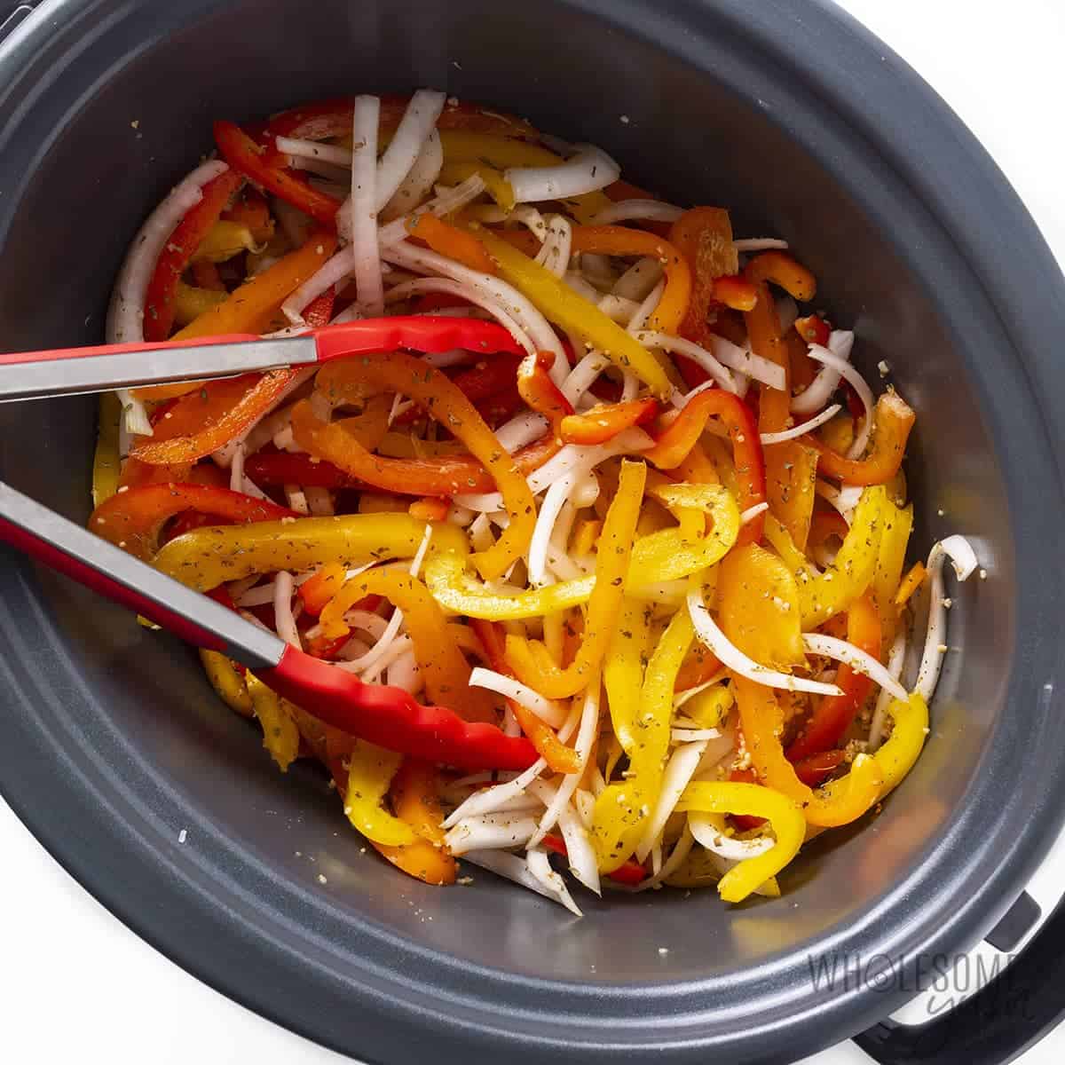 Bell peppers and onions in the slow cooker.