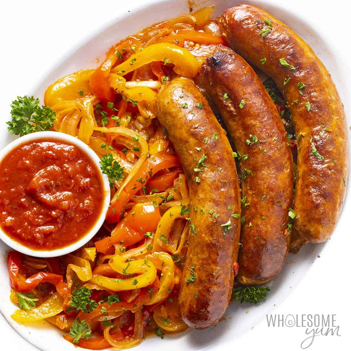 Sausage and peppers recipe on a serving platter.