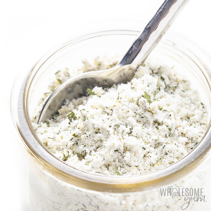 Close up of homemade ranch seasoning in a jar with a spoon