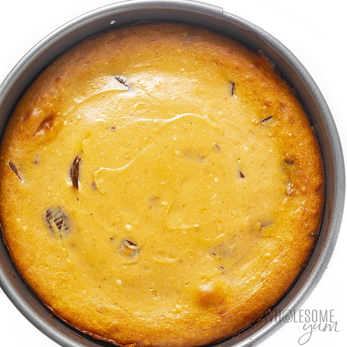 Overhead view of a cooked peanut butter cup cheesecake in a spring form pan