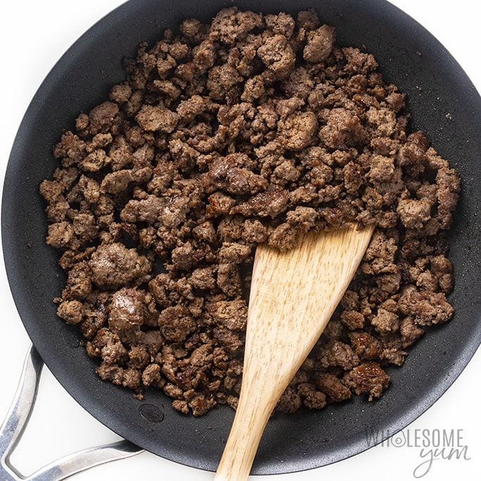 Overhead view of ground beef in a skillet being cooked for keto sloppy joe recipe