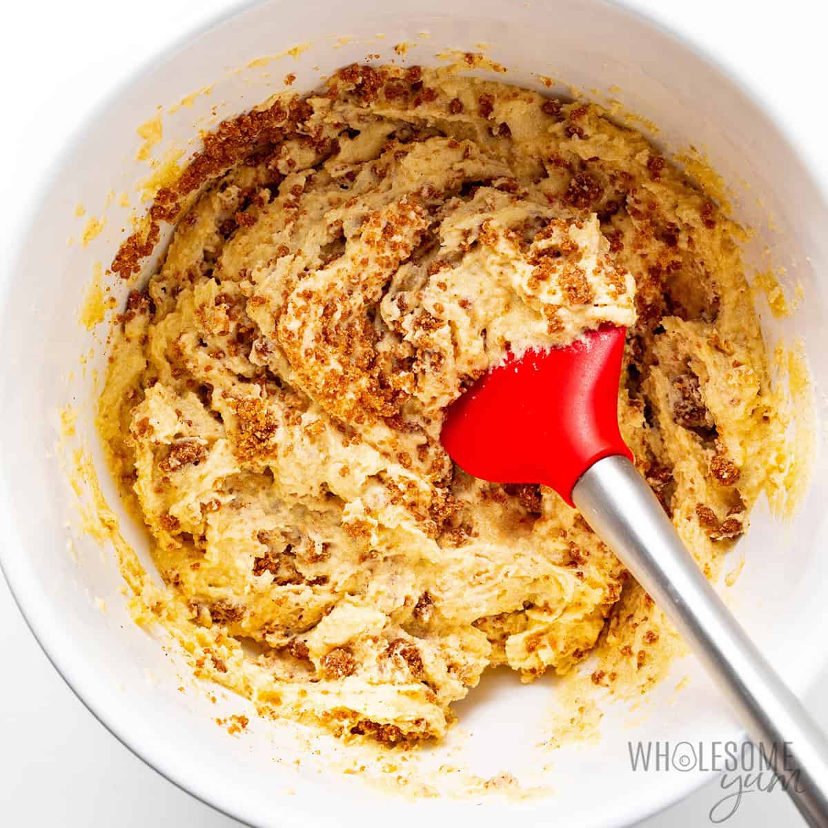 Folding the streusel into the batter.