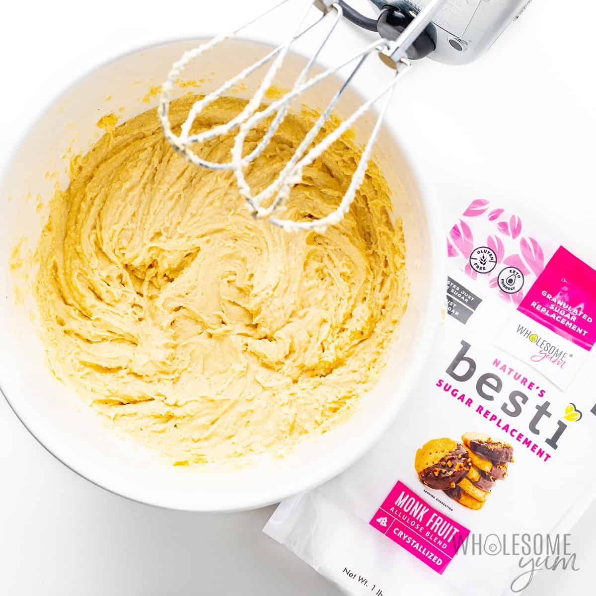 Dry ingredients added to the bowl and beaten until a thick batter forms.