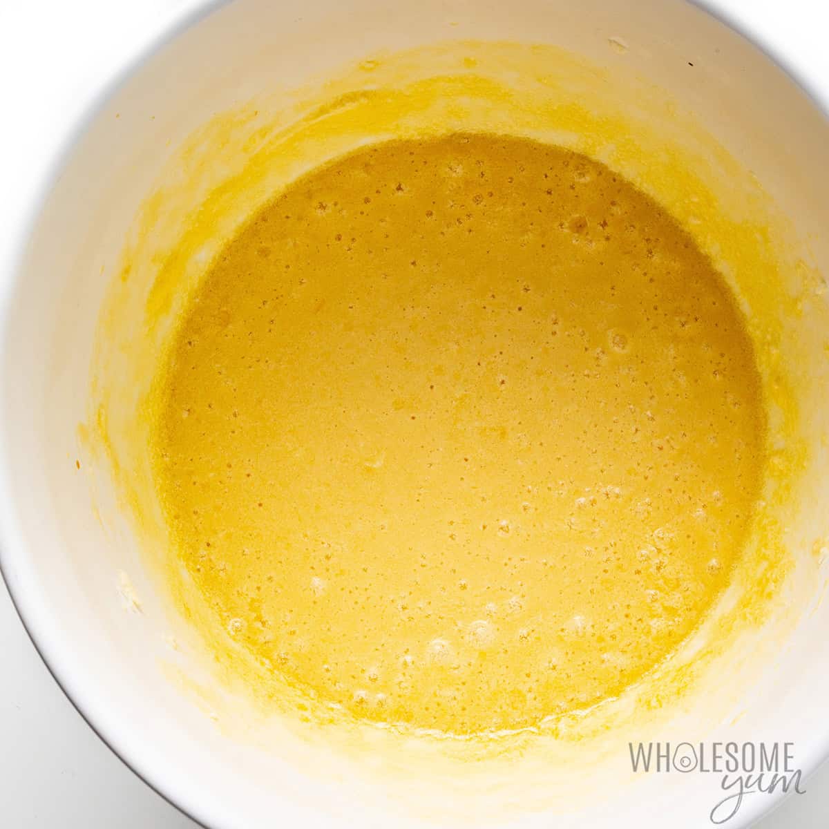 Wet ingredients beaten together in a bowl.