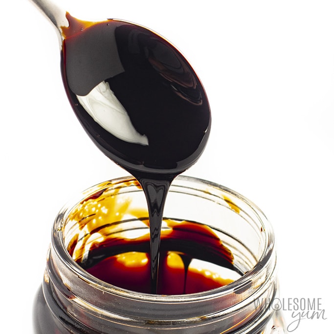 Balsamic reduction dripping off a spoon