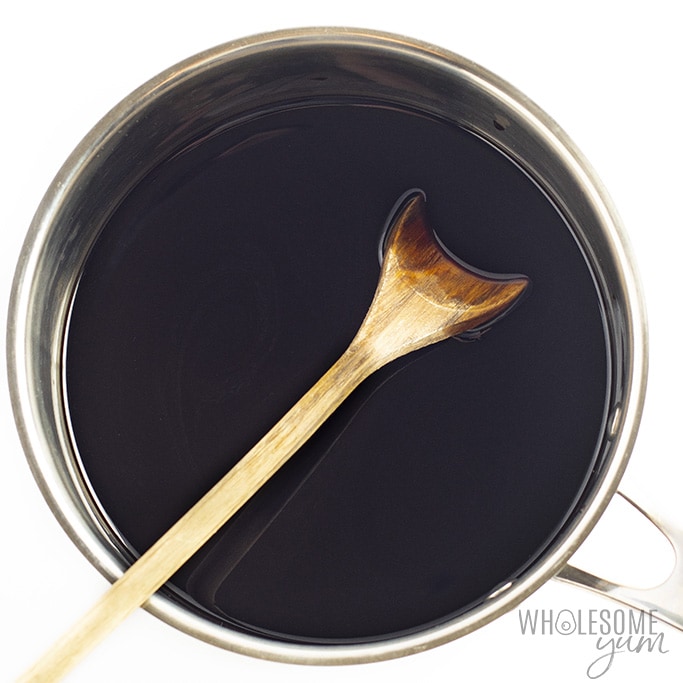 Balsamic vinegar in a saucepan with a wooden spoon
