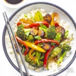 Vegetable stir fry recipe served in a bowl with chopsticks