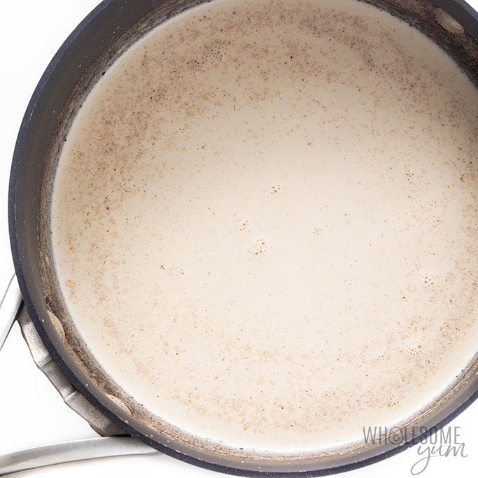 Almond milk, cream and spices in a saucepan