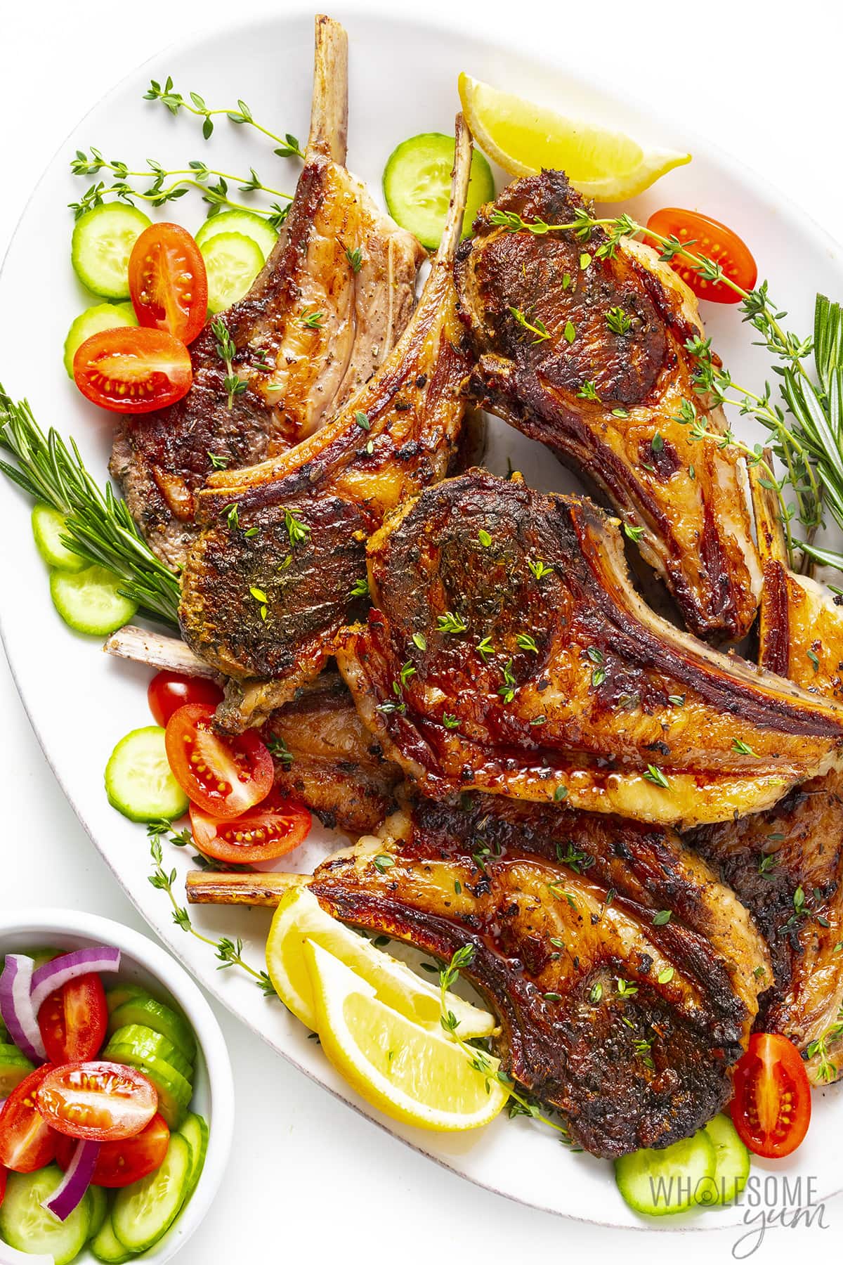 Oven baked lamb chops recipe on a platter.