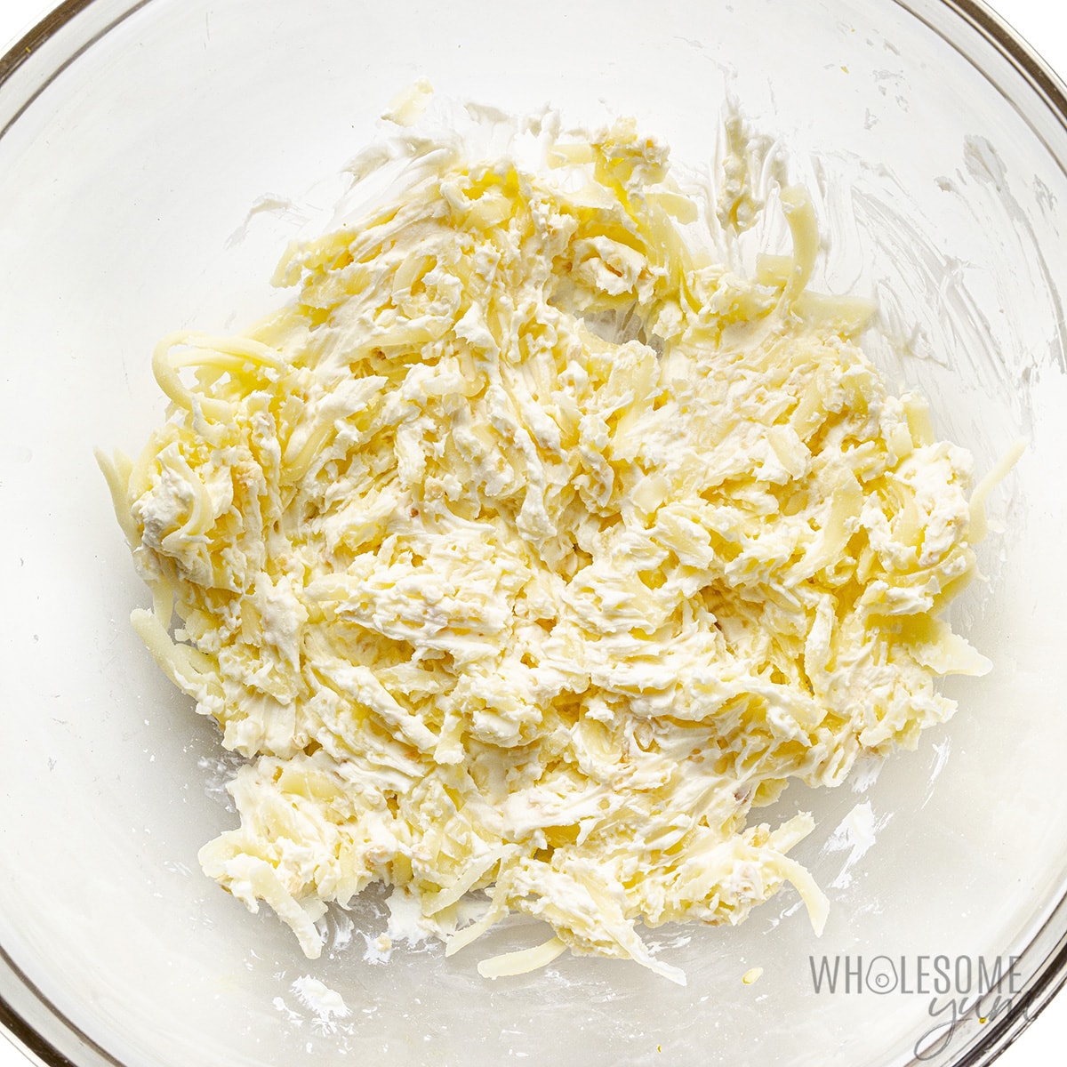 Add mozzarella cheese to mixture in bowl.