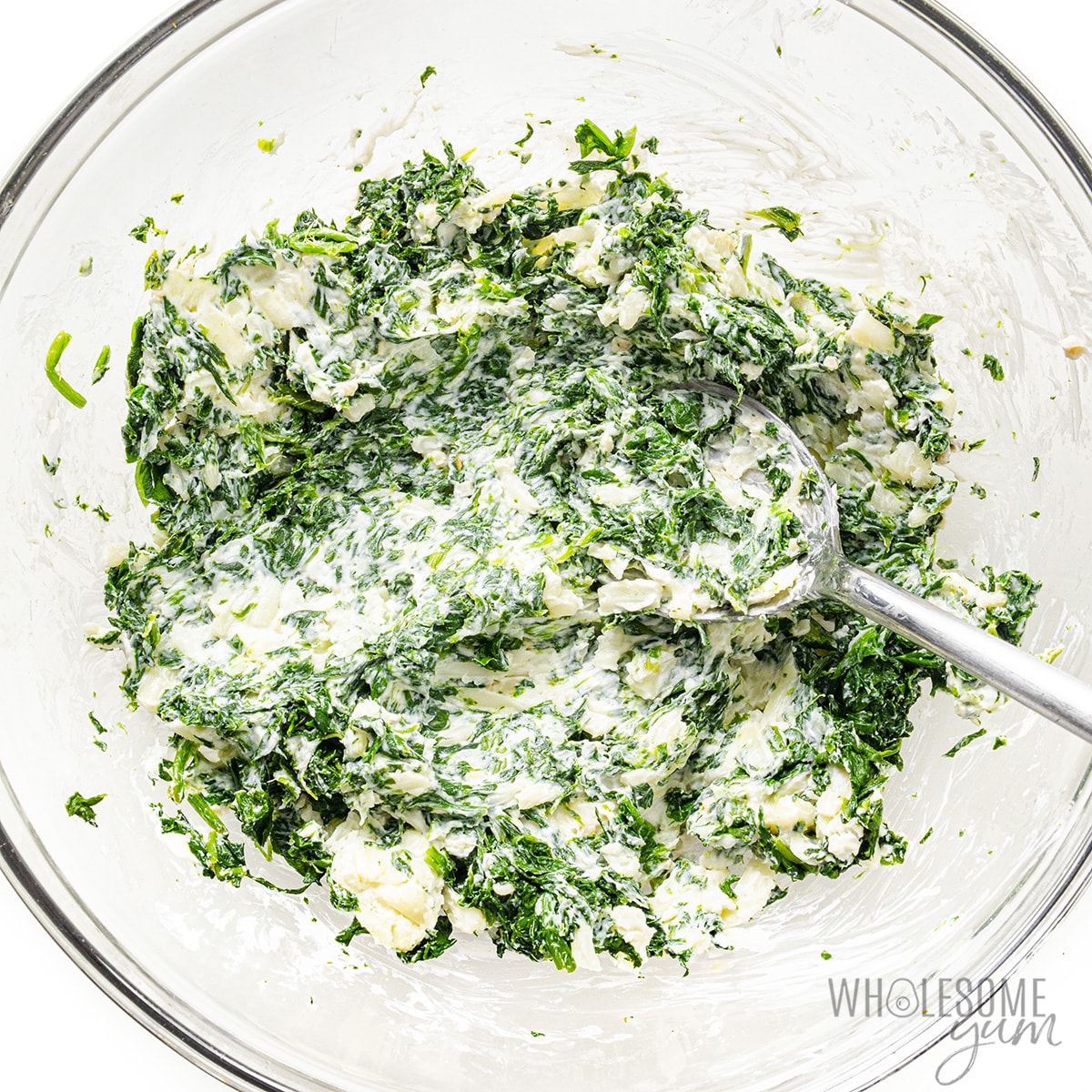 Combine spinach in bowl with cheese mixture.